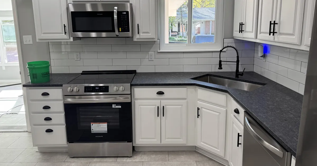 Clean kitchen countertops, sink and range after a one-time house cleaning